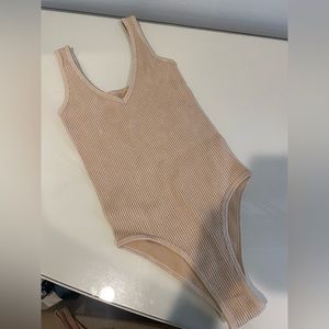Cream ish pink ish body suit